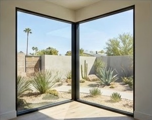 Frameless corner window